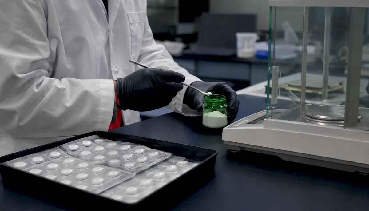 Close-up of tablets and powder formats on lab desk